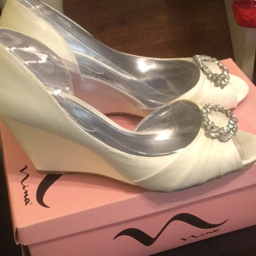 Elegant, ivory luster wedge-heel dress shoes